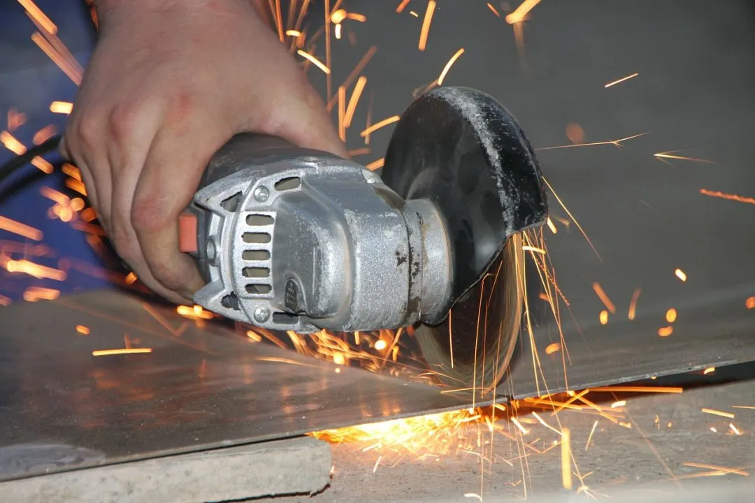 Cutting sheet of metal with hand saw